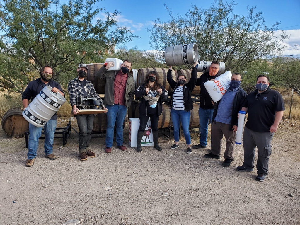 tombstone brewing working outside carrying supplies collab